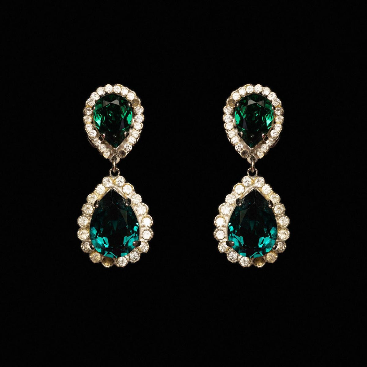 Drop earrings with two green pear-cut crystals each ringed in clear stones