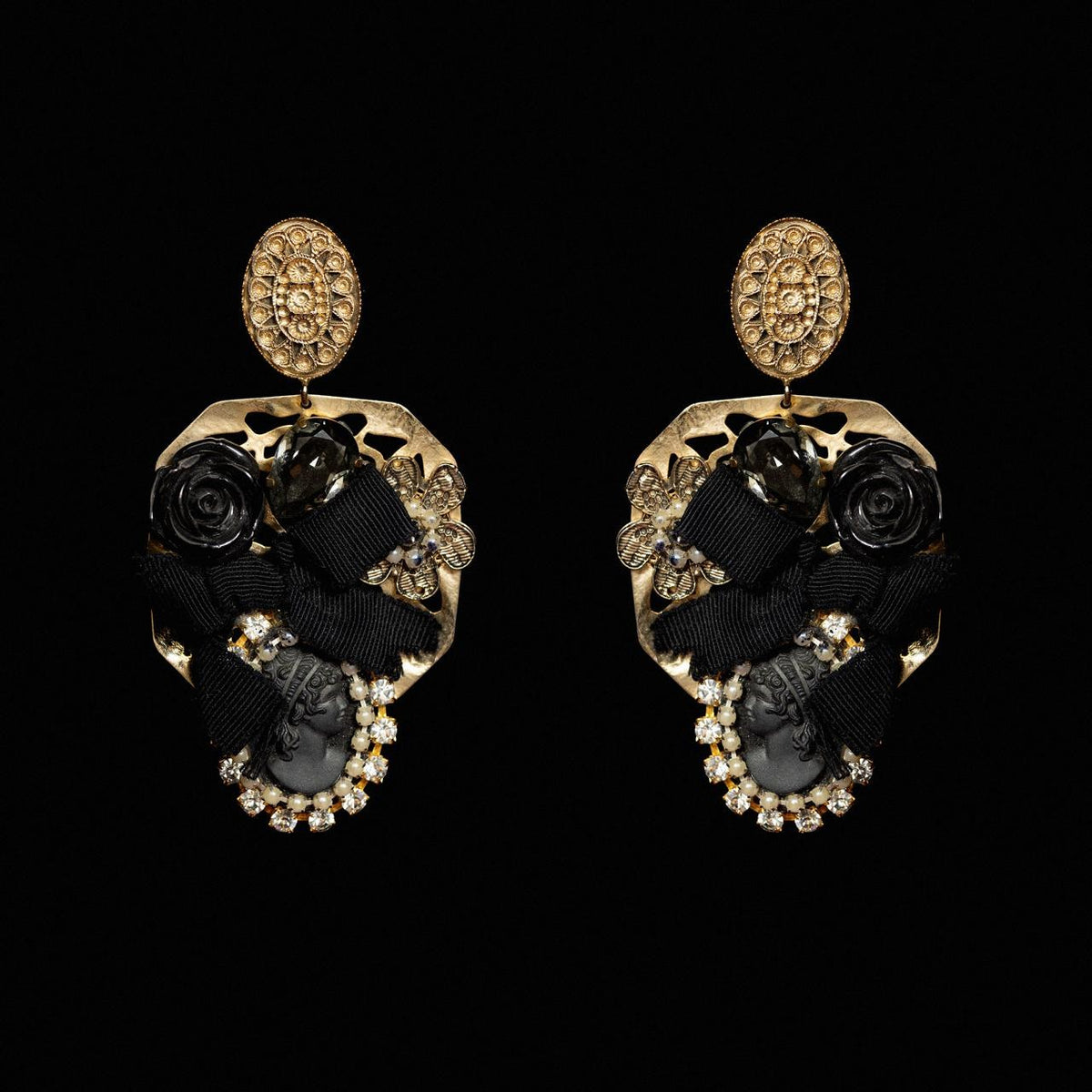 Gold-tone earrings with a carved black rose, black grosgrain bow and a black cameo