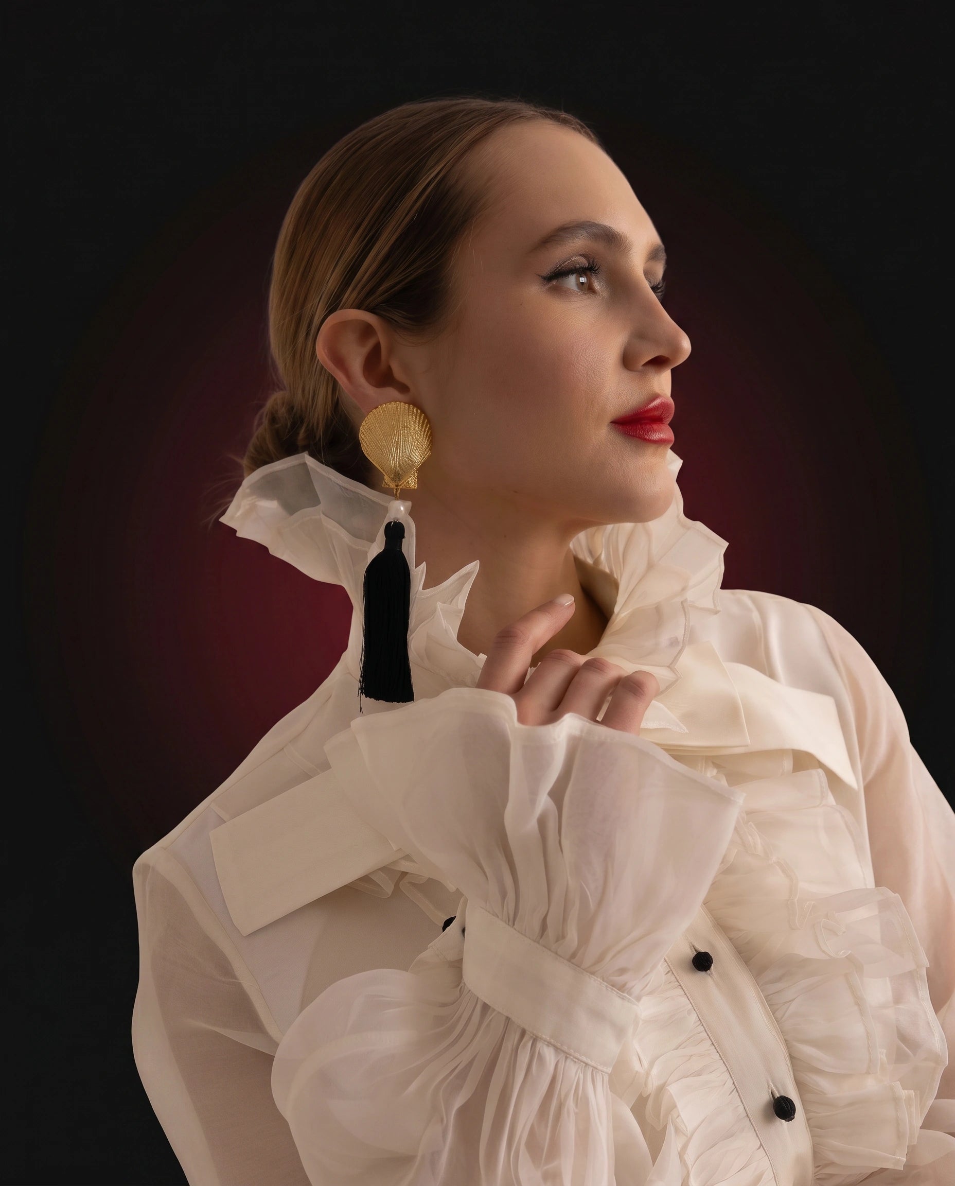 Ivory organza ruffled blouse with black patent flared mini skirt, collar and cuff detail
