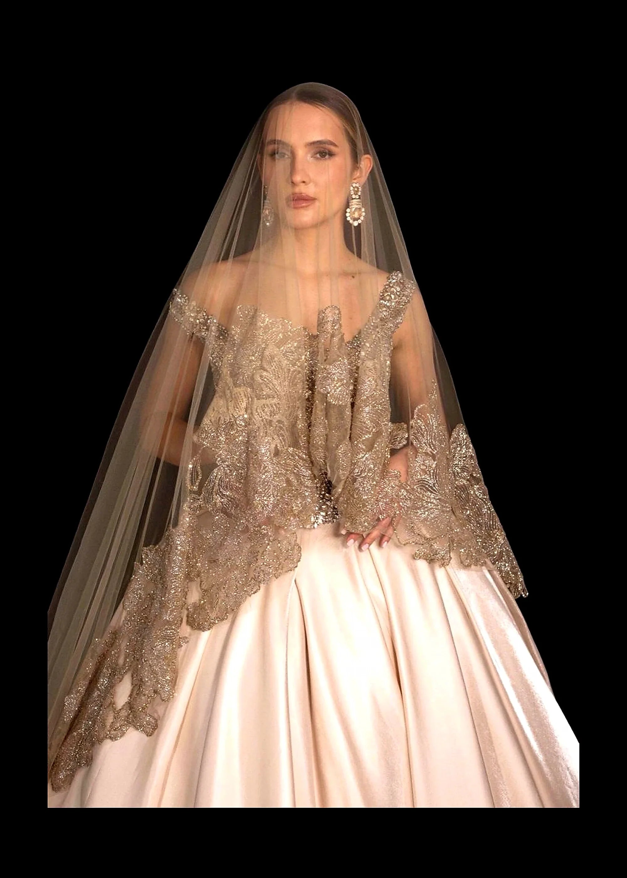 Champagne satin ballgown with a beaded bodice, pearl crown and gold-lace veil.