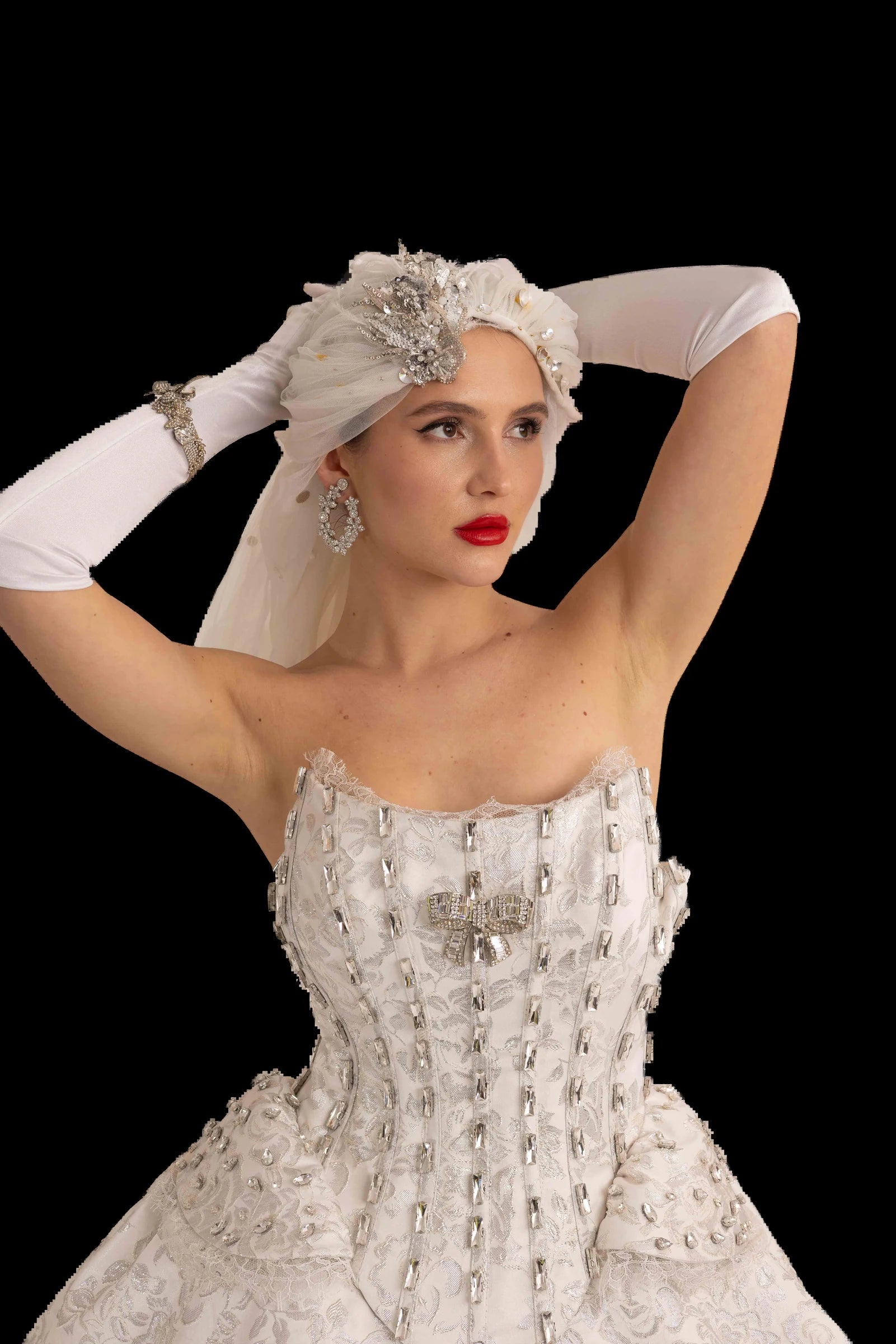 Ivory and silver brocade bridal ball gown with crystal-boned corset bodice, front view worn with tulle veil headpiece
