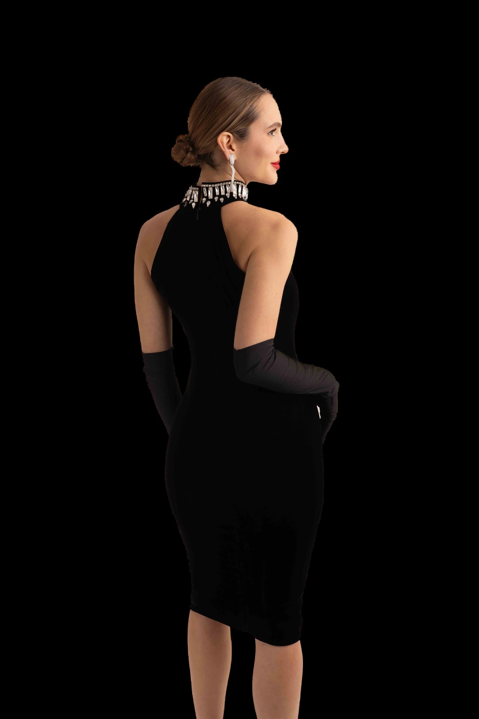 Black velvet halter midi dress, back three-quarter view