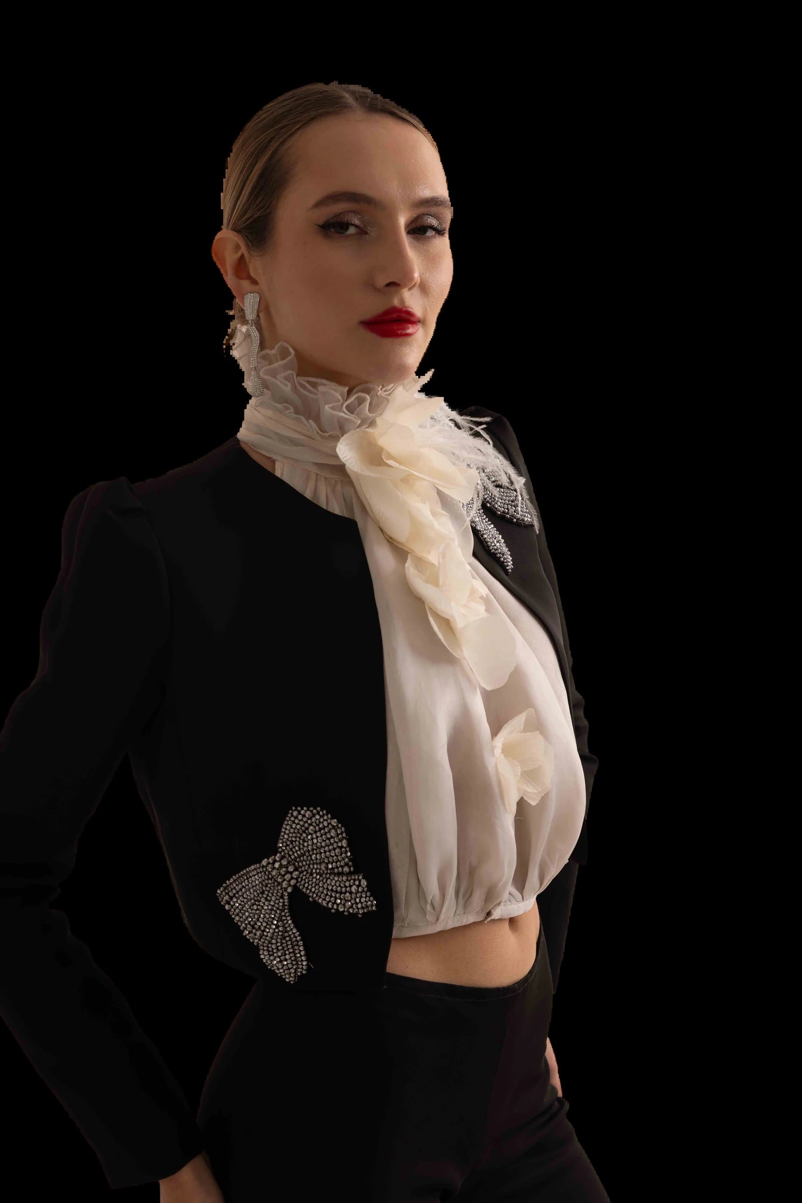 Black cropped jacket, ivory organza rosette blouse and flared black trousers, blouse and collar detail