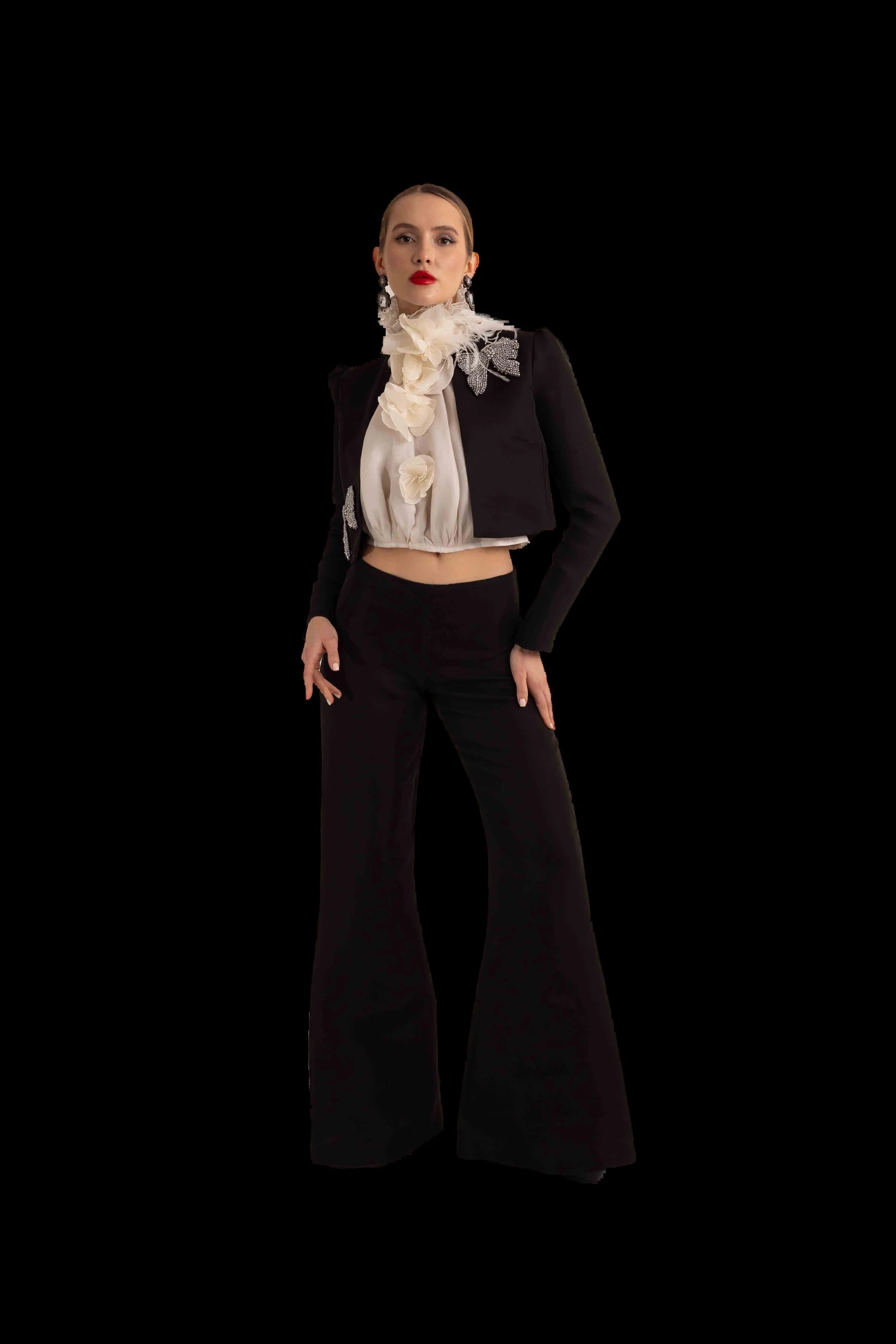 Black cropped jacket, ivory organza rosette blouse and flared black trousers, full front view