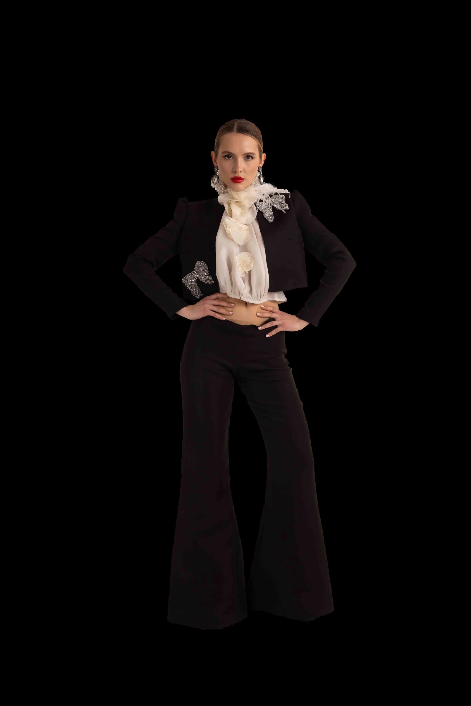 Black cropped jacket, ivory organza rosette blouse and flared black trousers, full front view