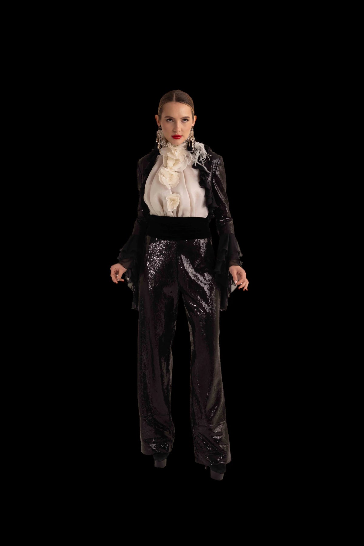 Black sequin trousers with ivory ruffled blouse and black chiffon bolero, full front view