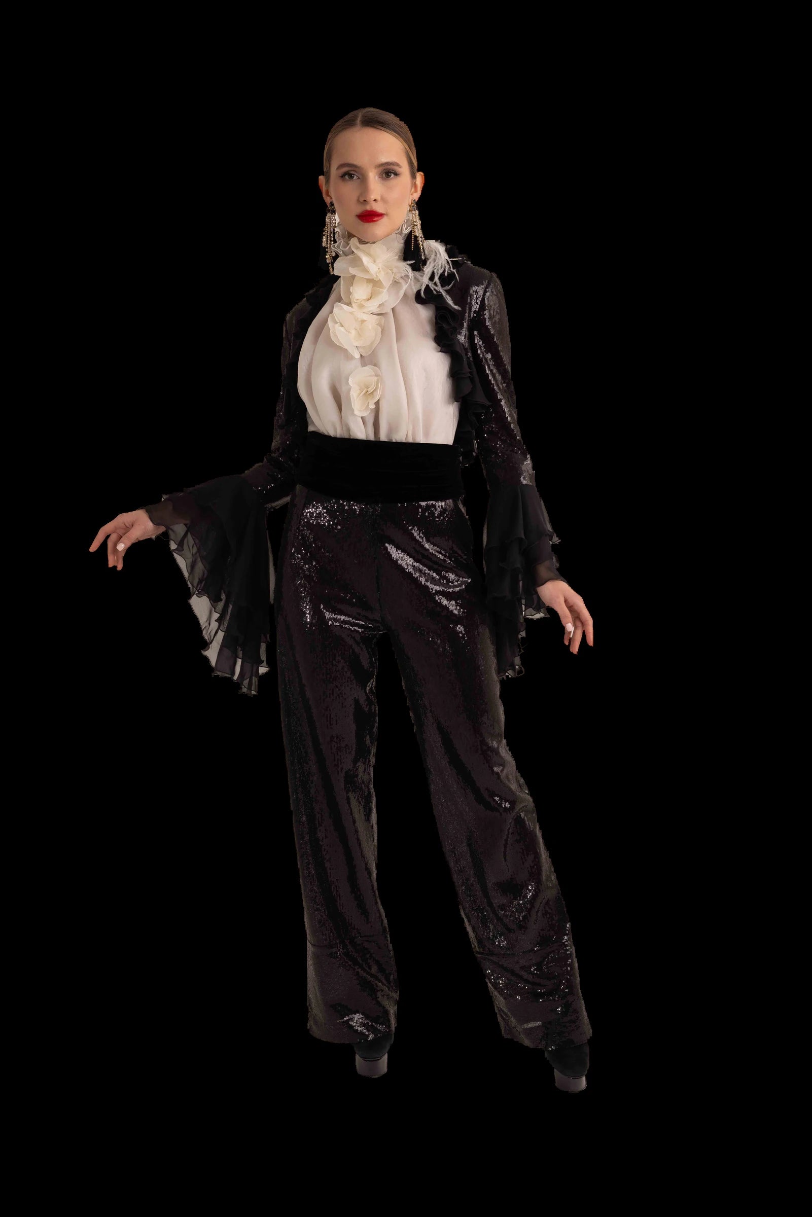 Black sequin trousers with ivory ruffled blouse and black chiffon bolero, front view, sleeves extended