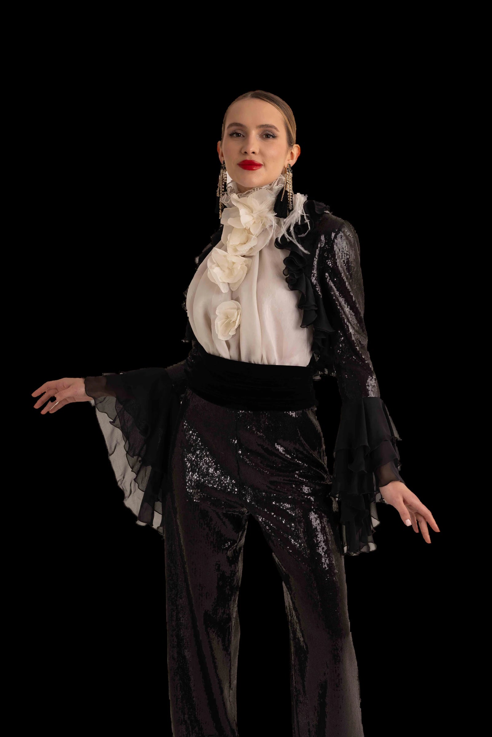 Black sequin trousers with ivory ruffled blouse and black chiffon bolero, front view, sleeve movement
