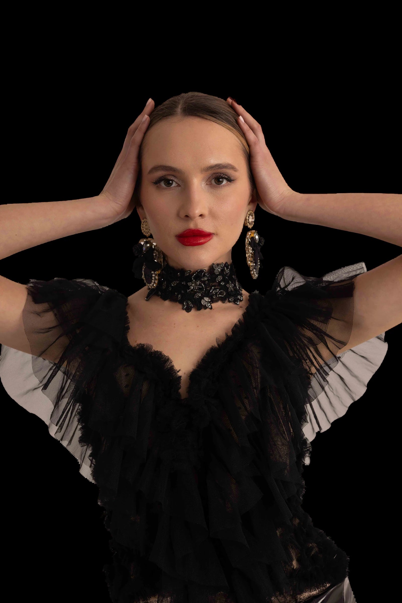 Black tulle corset gown with patent bodice, tulle train and bronze lame trousers, tulle bodice and collar detail