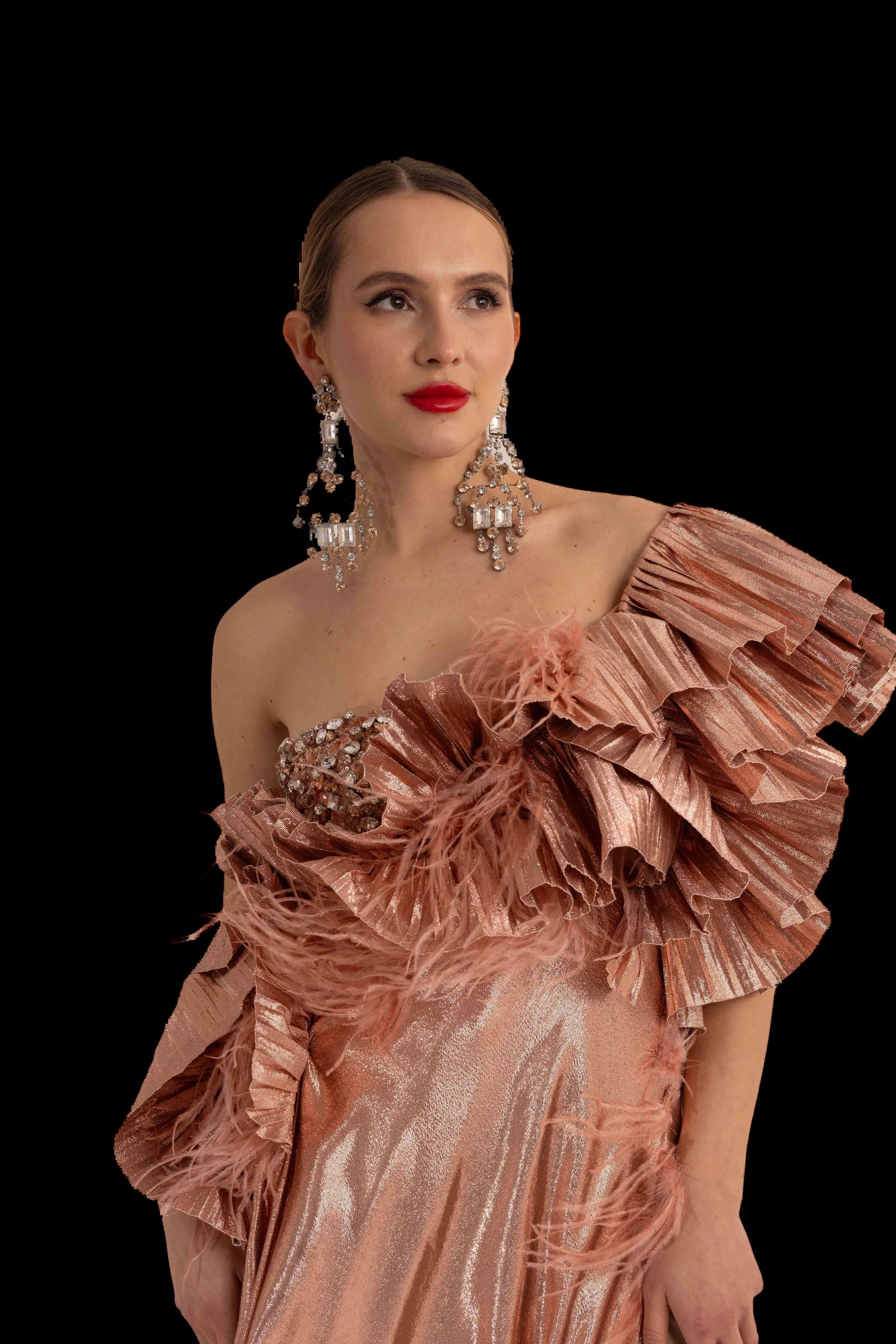Rose gold lame one-shoulder gown with pleated ruffle neckline, ruffle neckline and crystal band detail