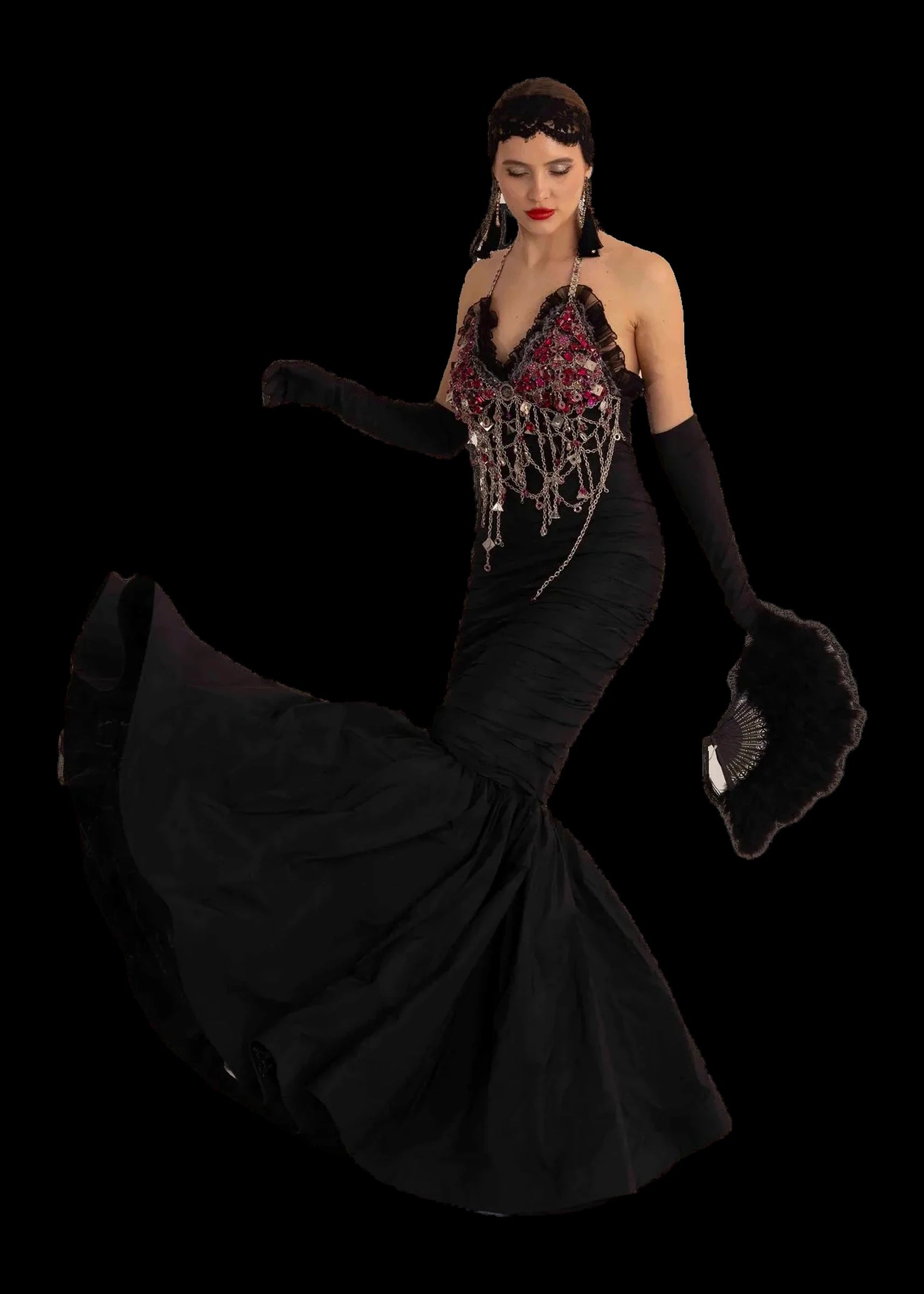 Black silk mermaid gown with crystal and fuchsia jewelled halter bodice, three-quarter view with feather fan