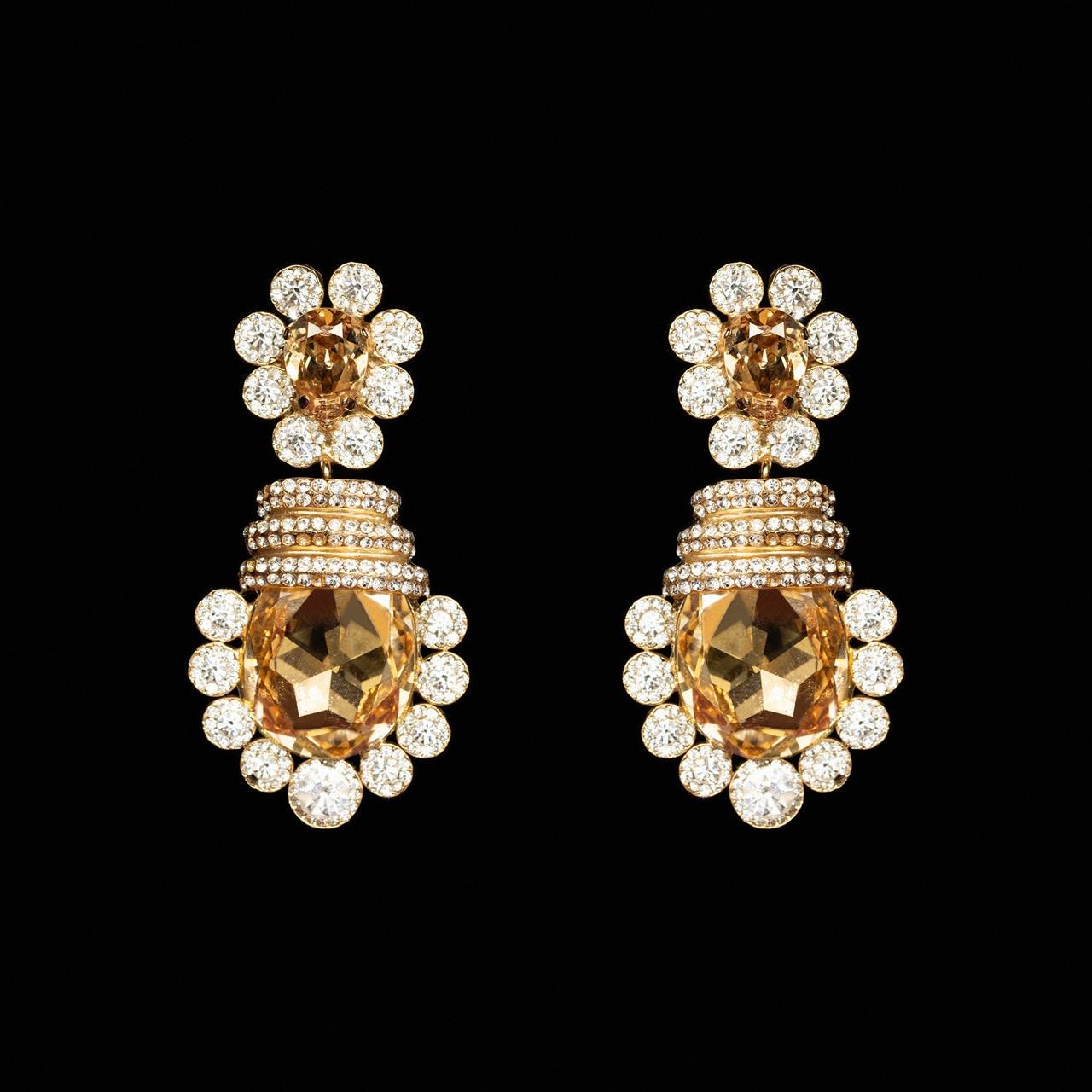 Gold-tone statement earrings with a large honey-gold cushion-cut crystal in a clear crystal halo