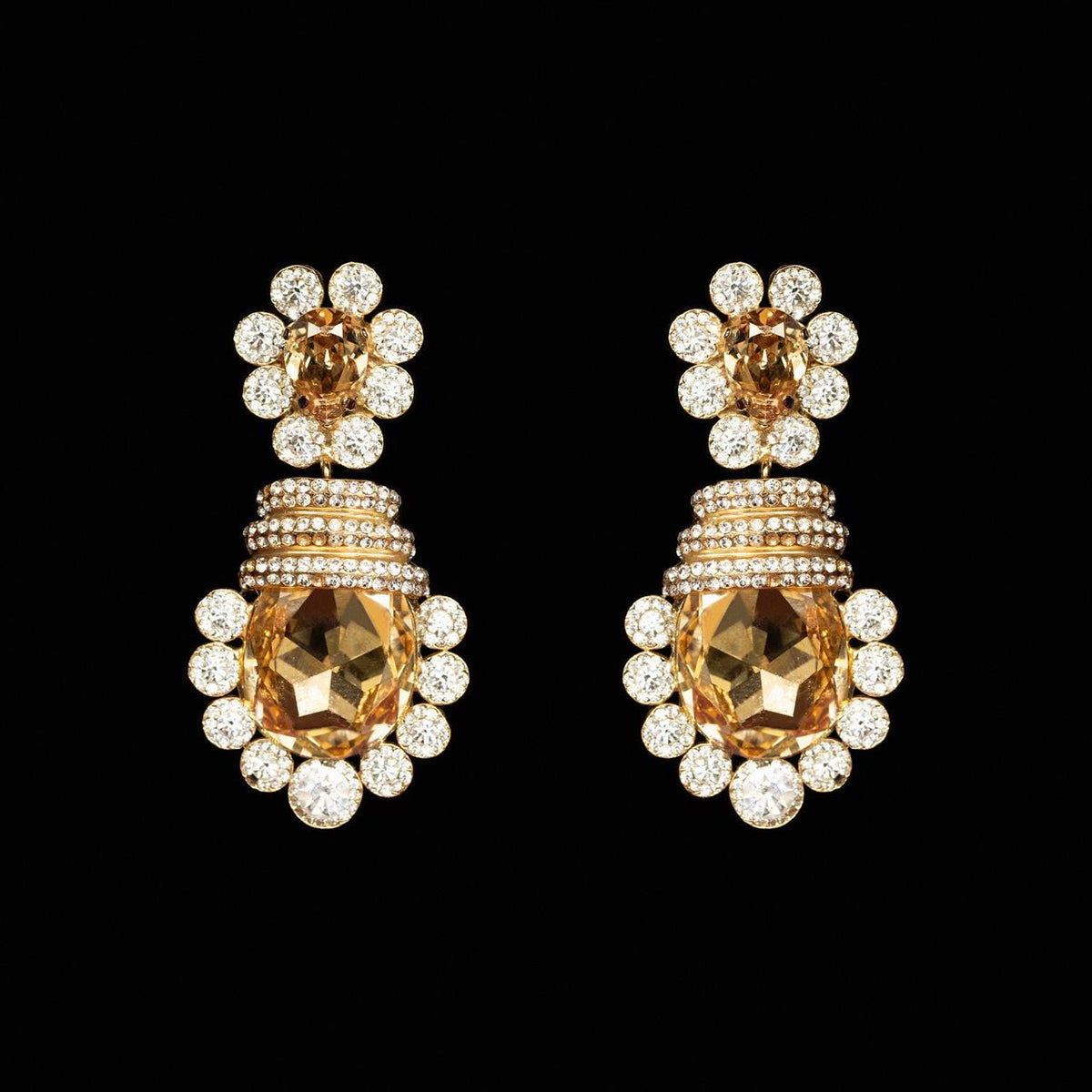 Gold-tone statement earrings with a large honey-gold cushion-cut crystal in a clear crystal halo