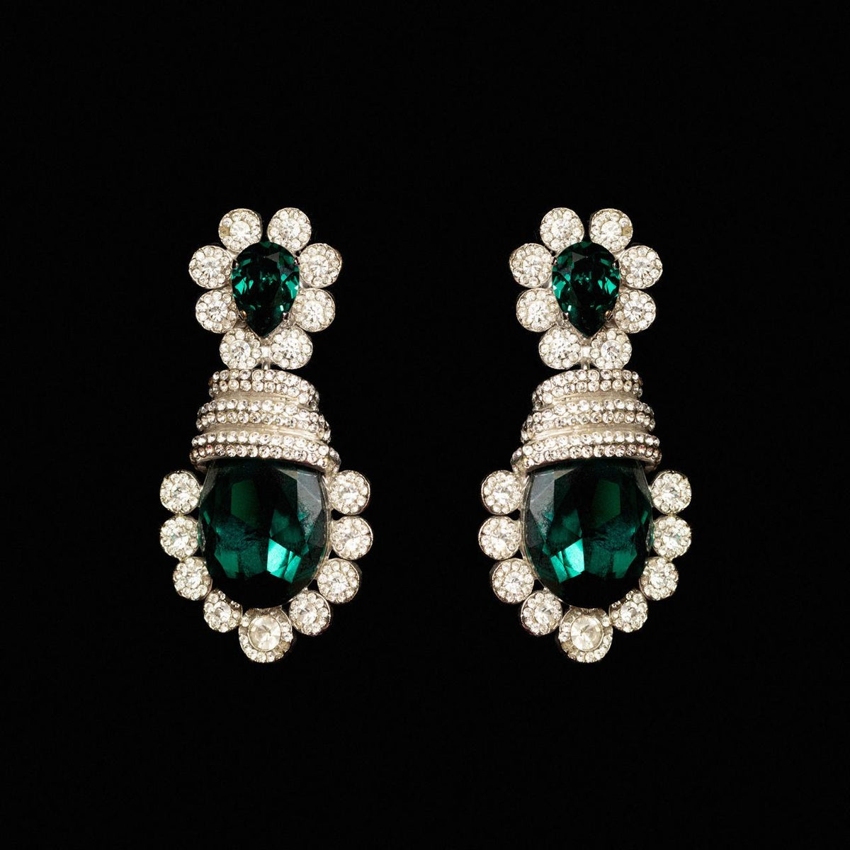 Statement drop earrings with deep green pear and oval crystals ringed in clear stones