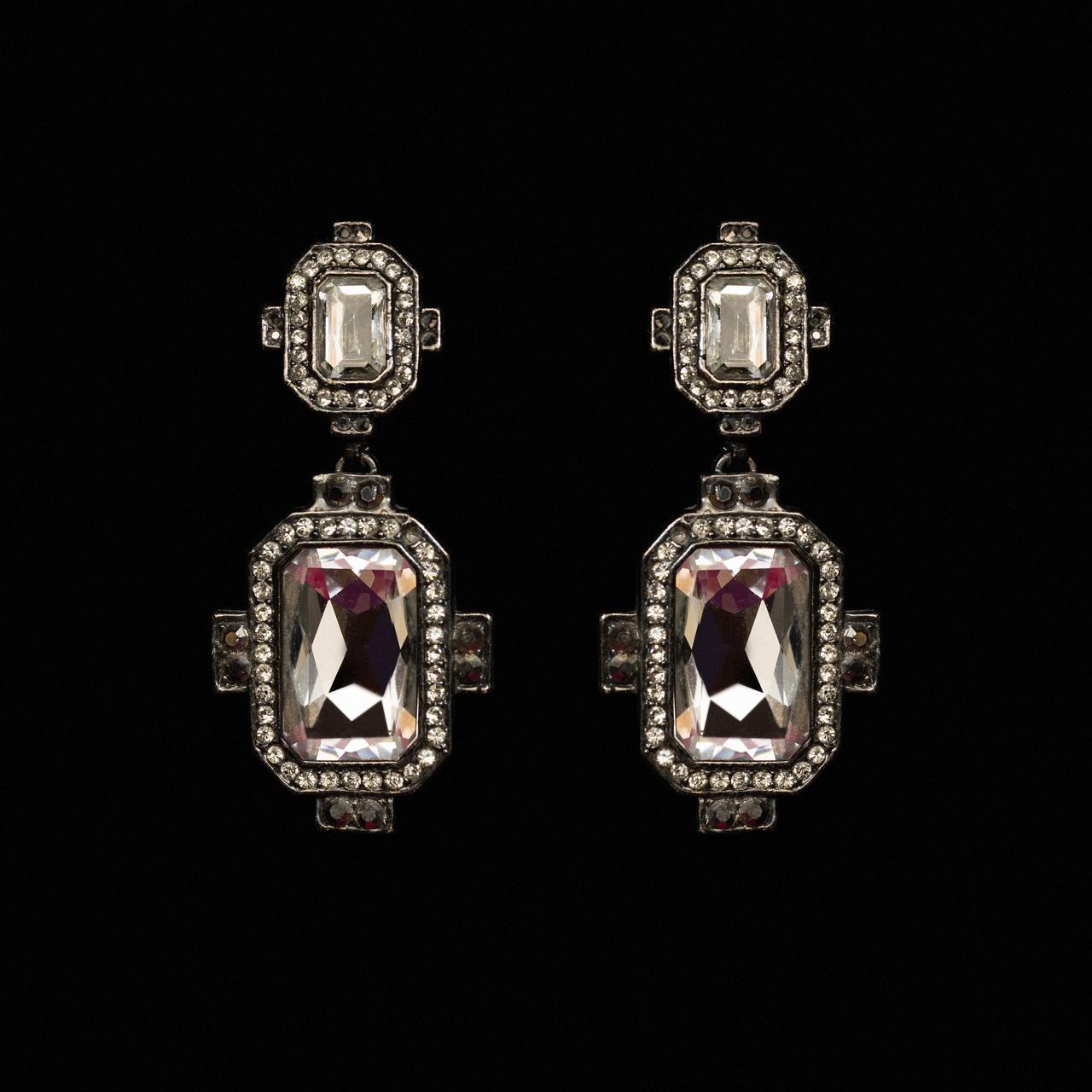 Art deco drop earrings with a large lilac emerald-cut crystal in a stepped pave frame