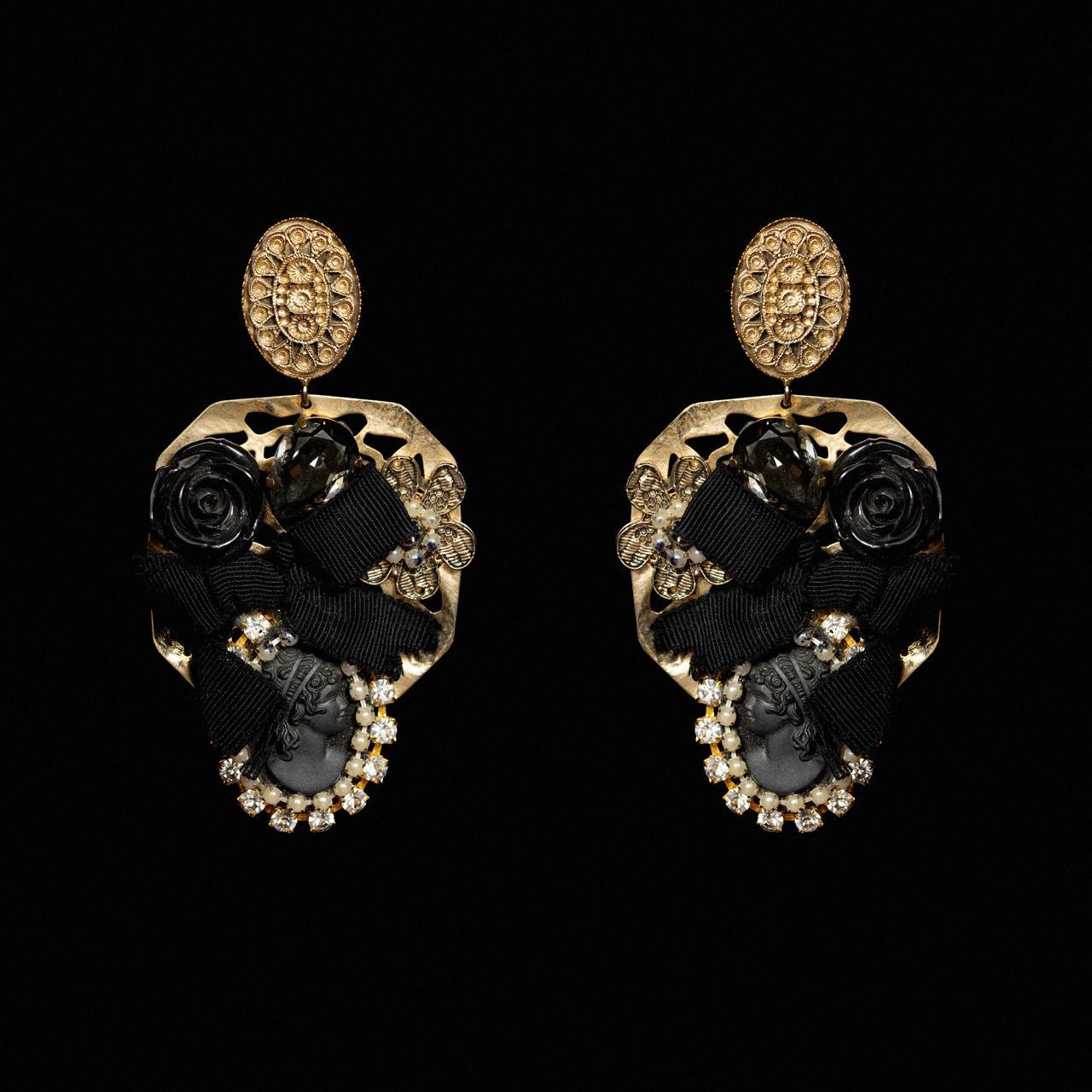 Gold-tone earrings with a carved black rose, black grosgrain bow and a black cameo