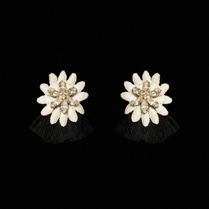 White carved petal flower earrings with a crystal centre and short black silk fringe