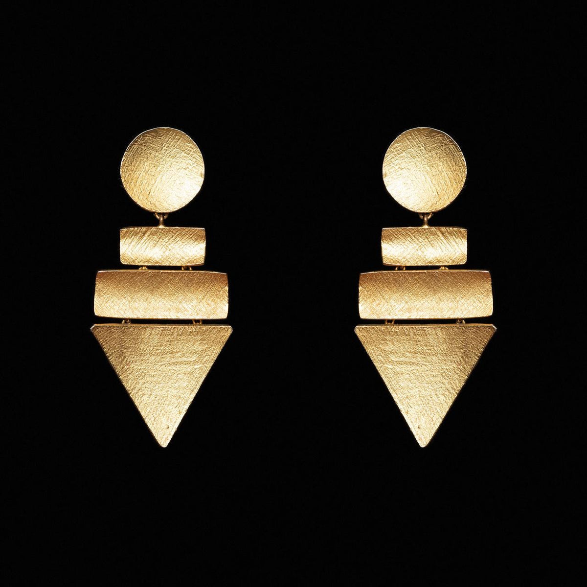 Brushed gold-tone geometric earrings made of a disc, two bars and an inverted triangle
