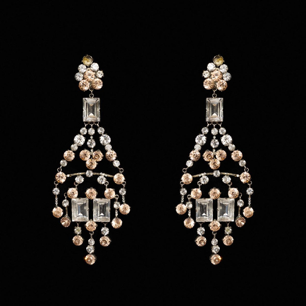 Openwork gold-tone chandelier earrings hung with peach and clear crystals