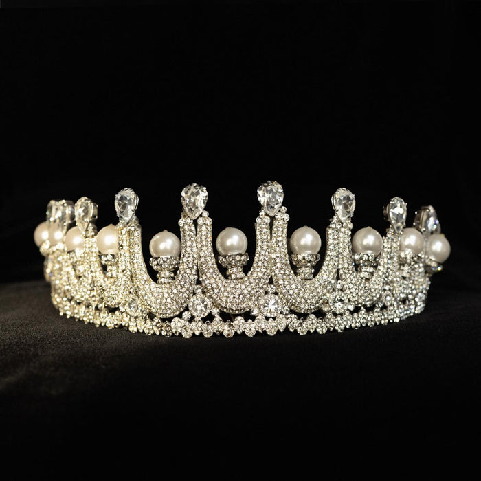 Tall bridal crown with pave crystal arches, pear-cut stones and large round pearls