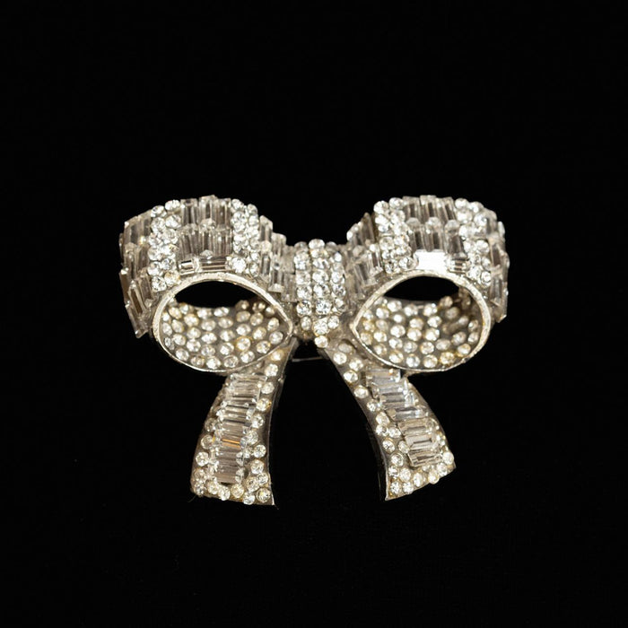 Clear crystal ribbon bow brooch in baguette and round pave with open loops