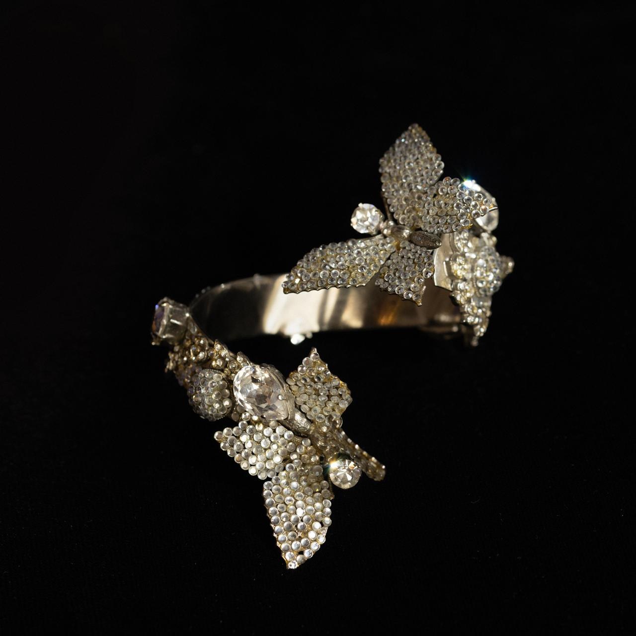Bypass bangle bracelet with two pave crystal butterflies and pear-cut clear stones