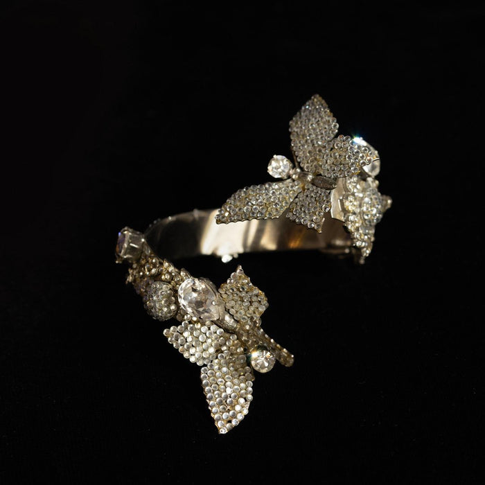 Bypass bangle bracelet with two pave crystal butterflies and pear-cut clear stones