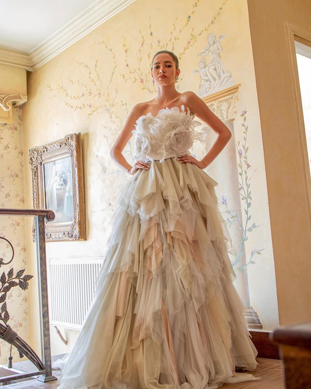 A flowered bodice above a layered tulle skirt.